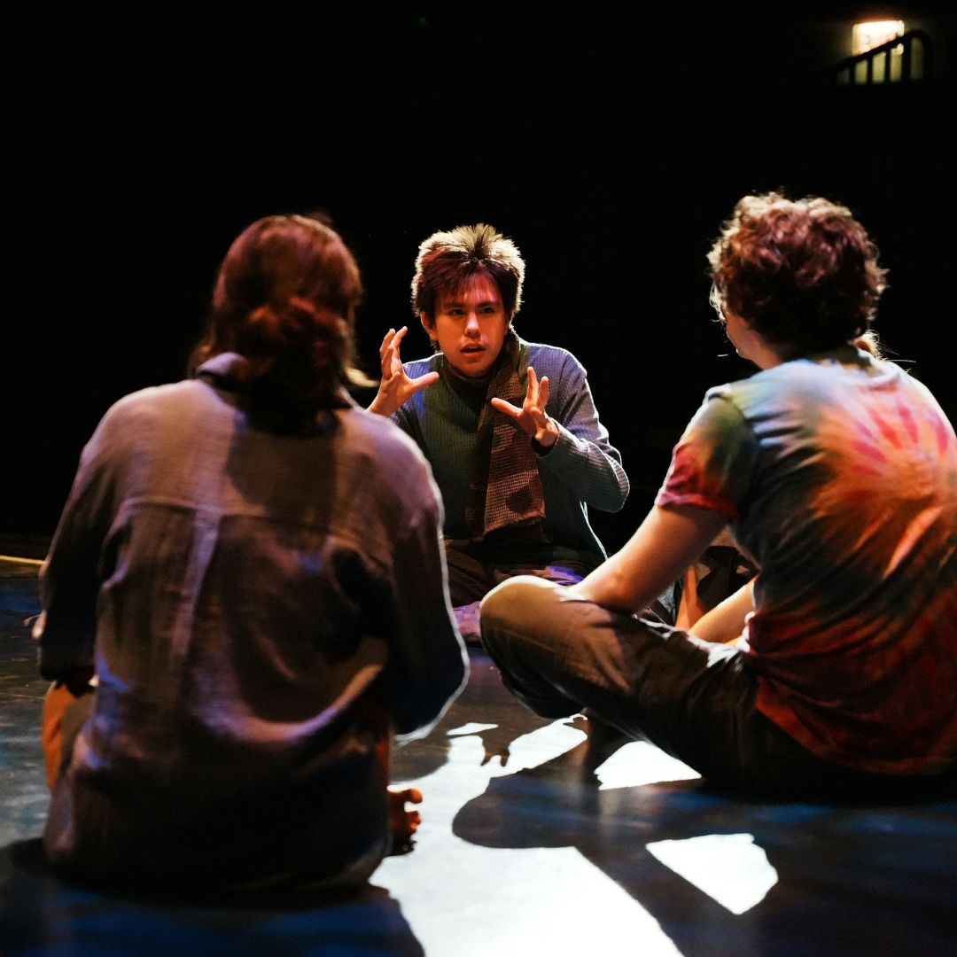 actors speaking on stage